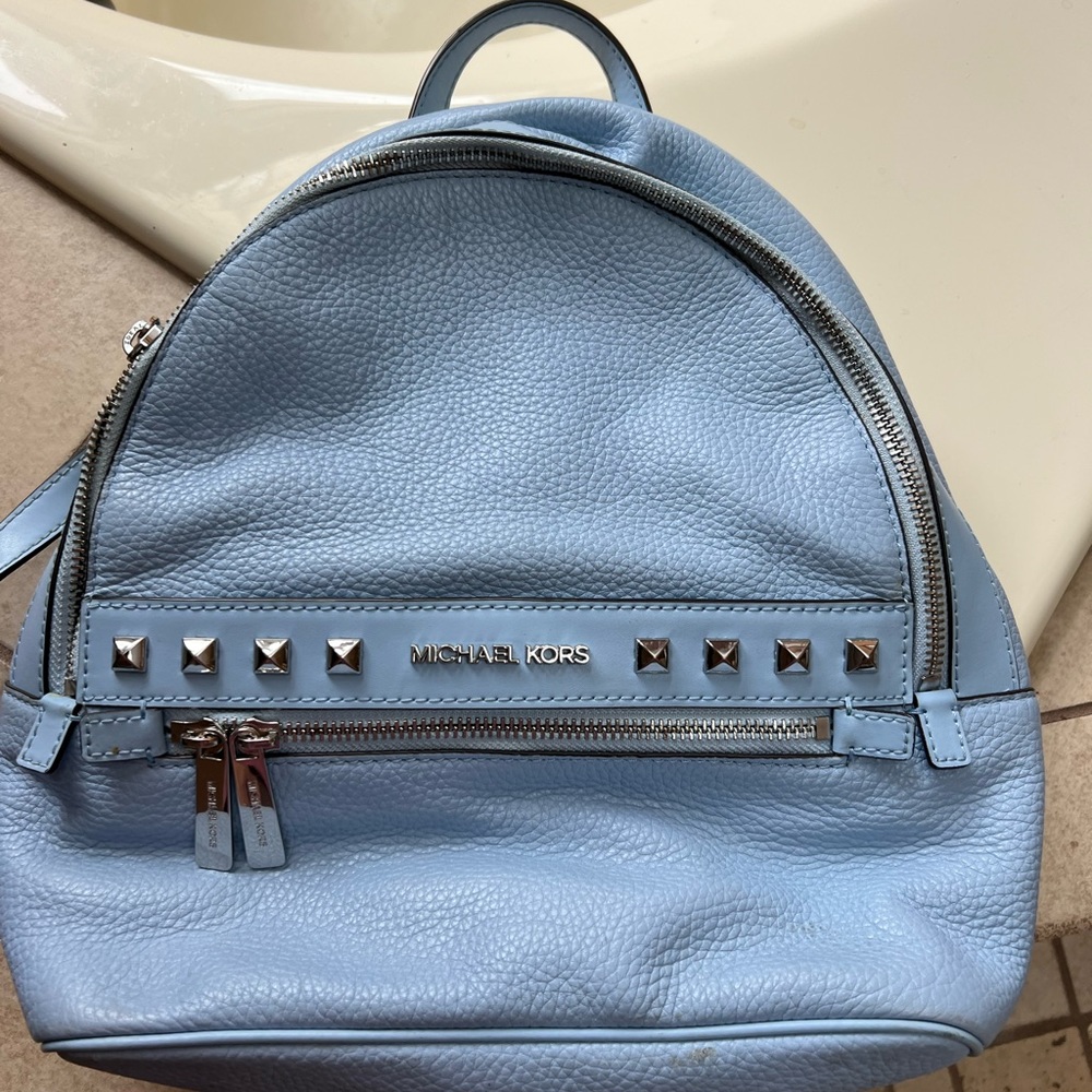 11”x 11” powder blue Michael Kors backpack.